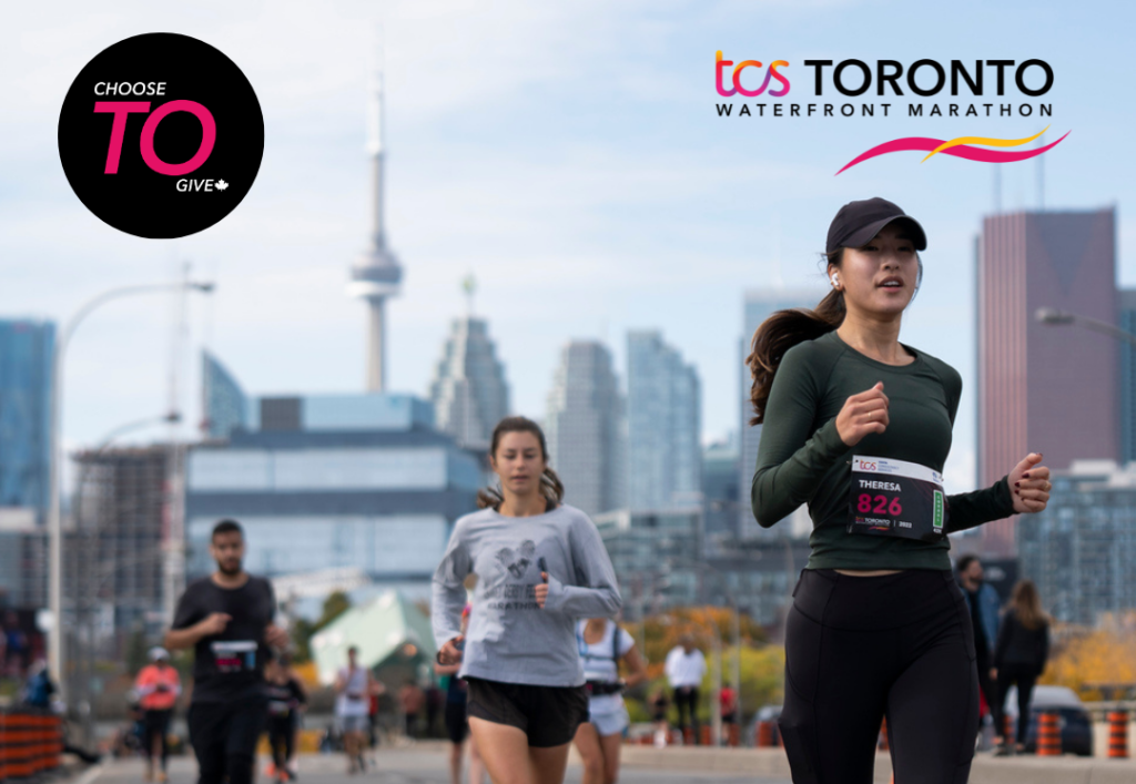 Runners with the CN tower in the background